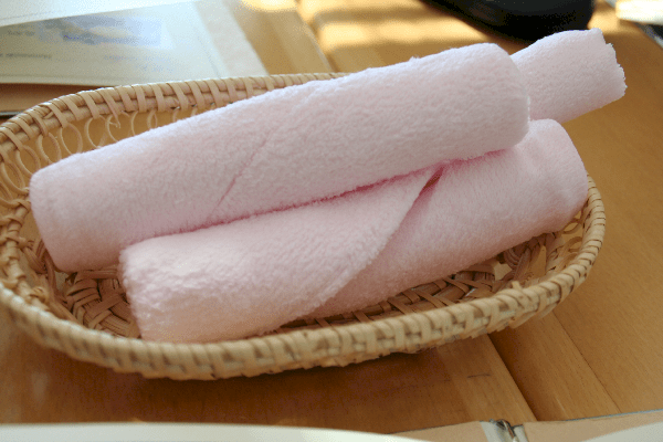 rolls of warm moist towels to freshen up