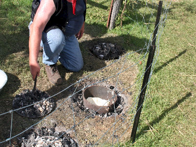 mixture over of pot in hot coals