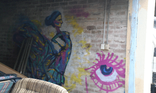 Mural on wall of abandoned garage