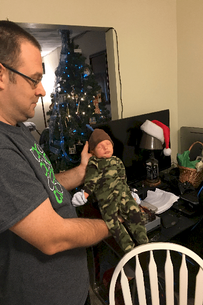 Proud papa and baby Joshua in his camo outfit